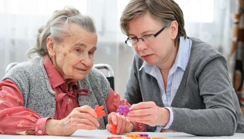 Senior woman with her elder care nurse